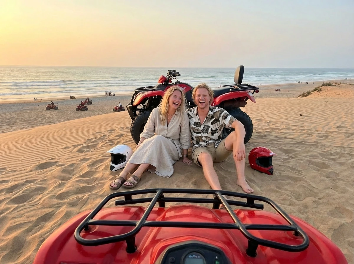 Couple relaxing on Agadir beach dunes after quad biking